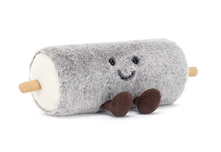 Peluche en forme de bûchette de chèvre