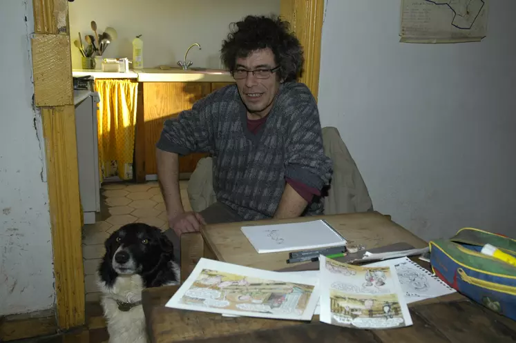 Alain Chrétien à sa table à dessin en février 2009