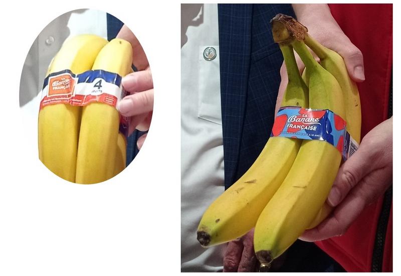 Une main de banane enrubannée en bleu-blanc-rouge; et une deuxième main de bananes avec un ruban coloré designé
