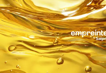 Le logo "empreinte by Saipol" sur une image en arrière plan d'une huile végétale en gros plan.