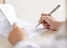 <em class="placeholder">Crop shot of person with pen signing contract at desk in daylight</em>