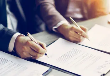 <em class="placeholder">Business young people in the job interview, signed an employment contract with boss in the office</em>