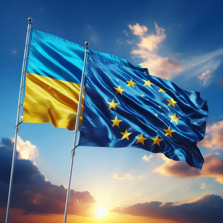 un drapeau de l'Ukraine et un drapeau de l'union européenne flottent au vent cote sur fond de ciel bleu 