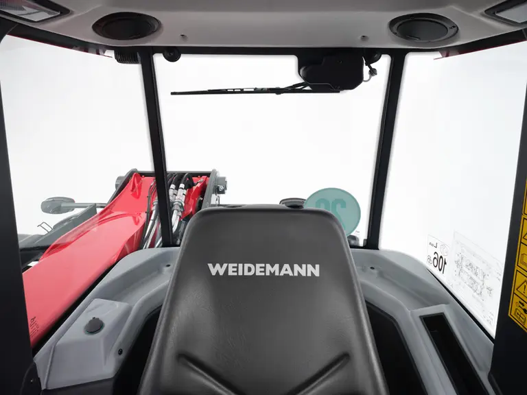 Le chargeur télescopique Weidemann T7 dispose d'une cabine à 4 montants et d'une flèche assez basse, profitant à la visibilité arrière