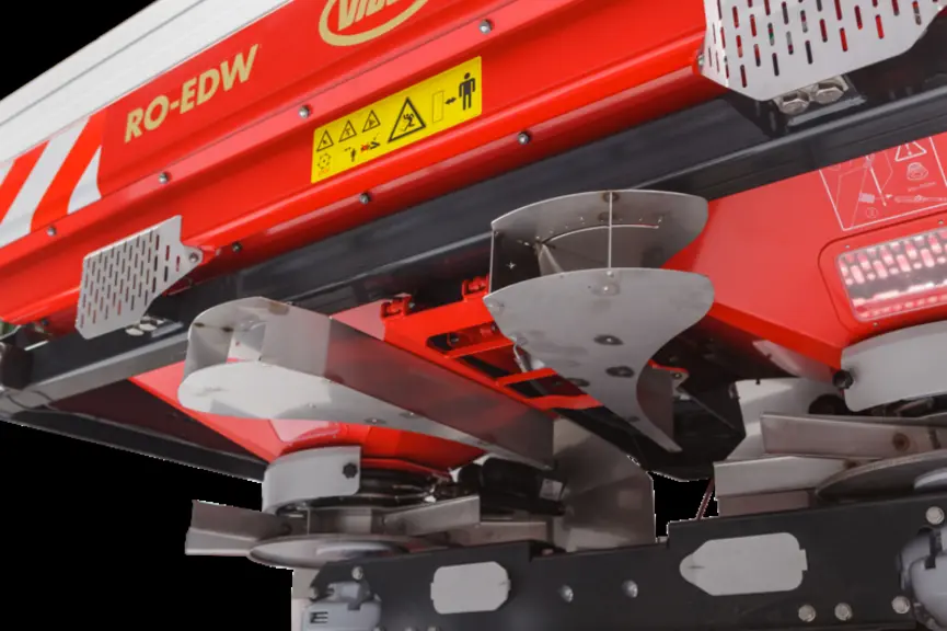 Le déflecteur central de Kverneland, Kubota et Vicon à activation hydraulique autorise au choix un épandage d'un seul côté ou des deux simultanément (