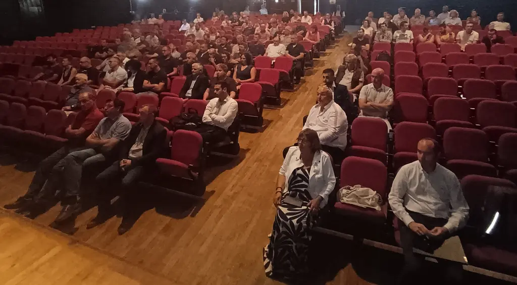 le public assis dans une salle