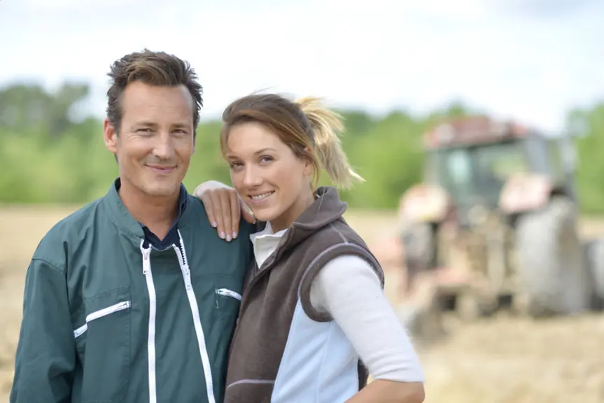 Couple of farmers standing in farming land