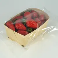 Les barquettes sous film flowpack cellulose régénérée permettent aux fraises de « respirer » grâce aux microperforations du film.