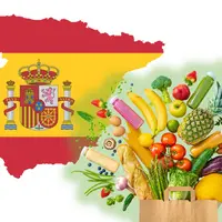 drapeau espagnol à la forme du pays; et un sac kraft débordant de fruits et légumes