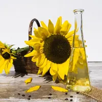 fleur de tournesol et flacon  d'huile végétale