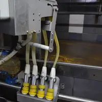 Les manchons sont ici en position de lavage. Il est possible d’ajouter un dispositif de désinfection entre deux vaches.