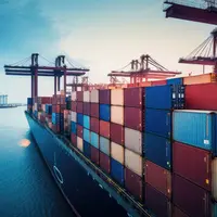 Container ship carrying container boxes import export dock with quay crane. Business commercial trade global cargo freight shipping logistic and trans