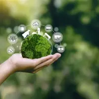Main tenant une planète verte avec un éleveur et une vache.