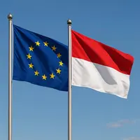 le drapeau de l'union européenne flotte a coté du drapeau de l'indonésie