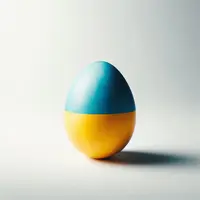 un oeuf dont la coquille est peinte du drapeau ukrainien