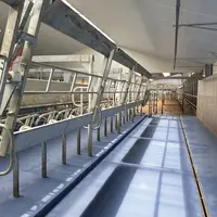 La salle de traite TPA XpressWay 3.0 de Boumatic profite d'une lice rotative actionnée pneumatiquement.