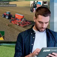 Opérateur consultant sur son ordinateur le travail de sa machine agricole.