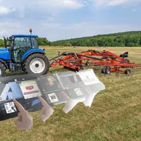 Tracteur New Holland attelé à un andaineur Kuhn
