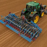 Semoir Monosem MS Electron 18 rangs derrière un tracteur John Deere  au champ