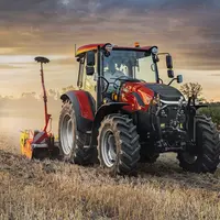 Tracteur Case IH Farmall 100A avec herse rotative Pöttinger