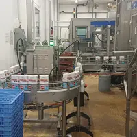 Les briques de lait Gérentes sur la chaine de production.