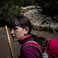 Sana avec son bâton.