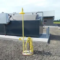 L’acidification au  bâtiment danoise intègre une douche en cas de contact direct de l’éleveur et de l’acide sulfurique.