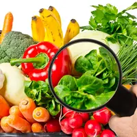 fruits et légumes avec une loupe au premier plan