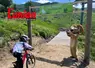 un enfant se lance à Vélo encouragé par la mascotte du Lioran