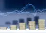 A stack of five rows of coins with graph dark blue background.