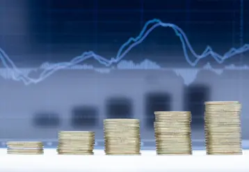 A stack of five rows of coins with graph dark blue background.