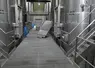 <em class="placeholder">Chai de la cave coopérative de Tutiac. Cuves en inox de 600 hl, goulotte pour décuvage, vis sans fin sous le sol grillagé pour évacuer le marc</em>